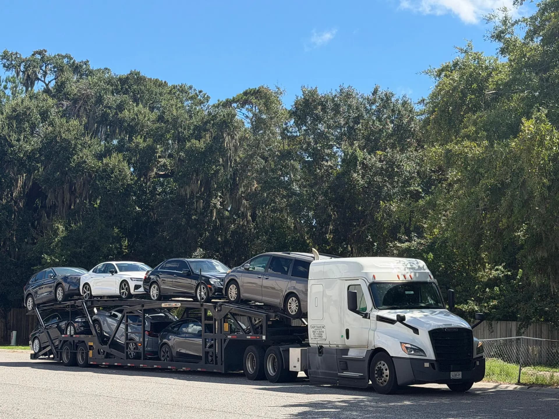 Car shipping truck loading a vehicle in New York